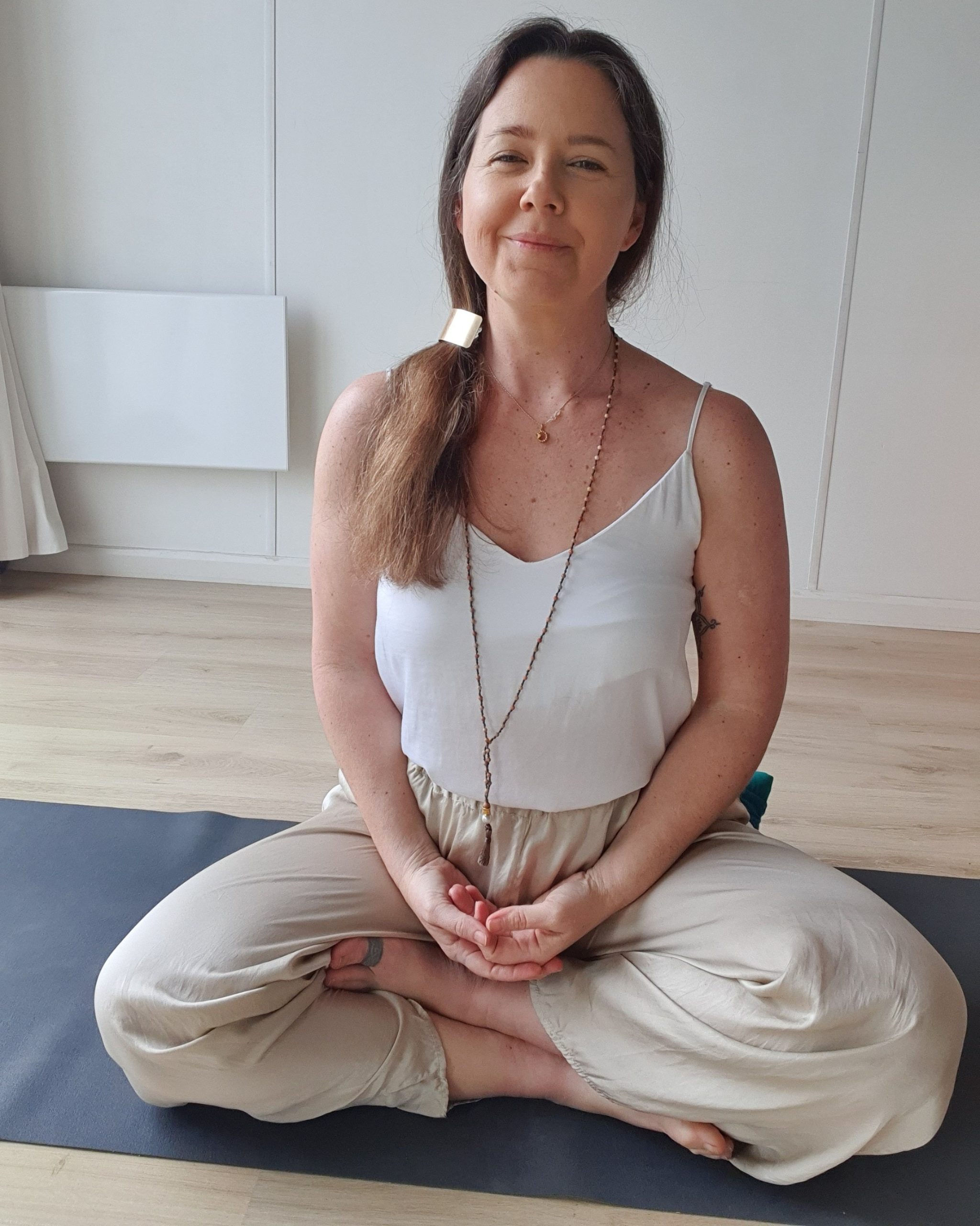 Lisa running an online yoga therapy session